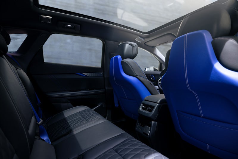Back Seat View of the 2026 OPTIQ-V Blue Front Seats, Sun Roof, and Interior | Lynn Layton Cadillac in Decatur AL