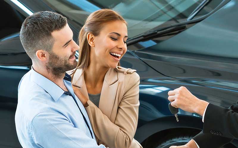 Happy Couple with Keys